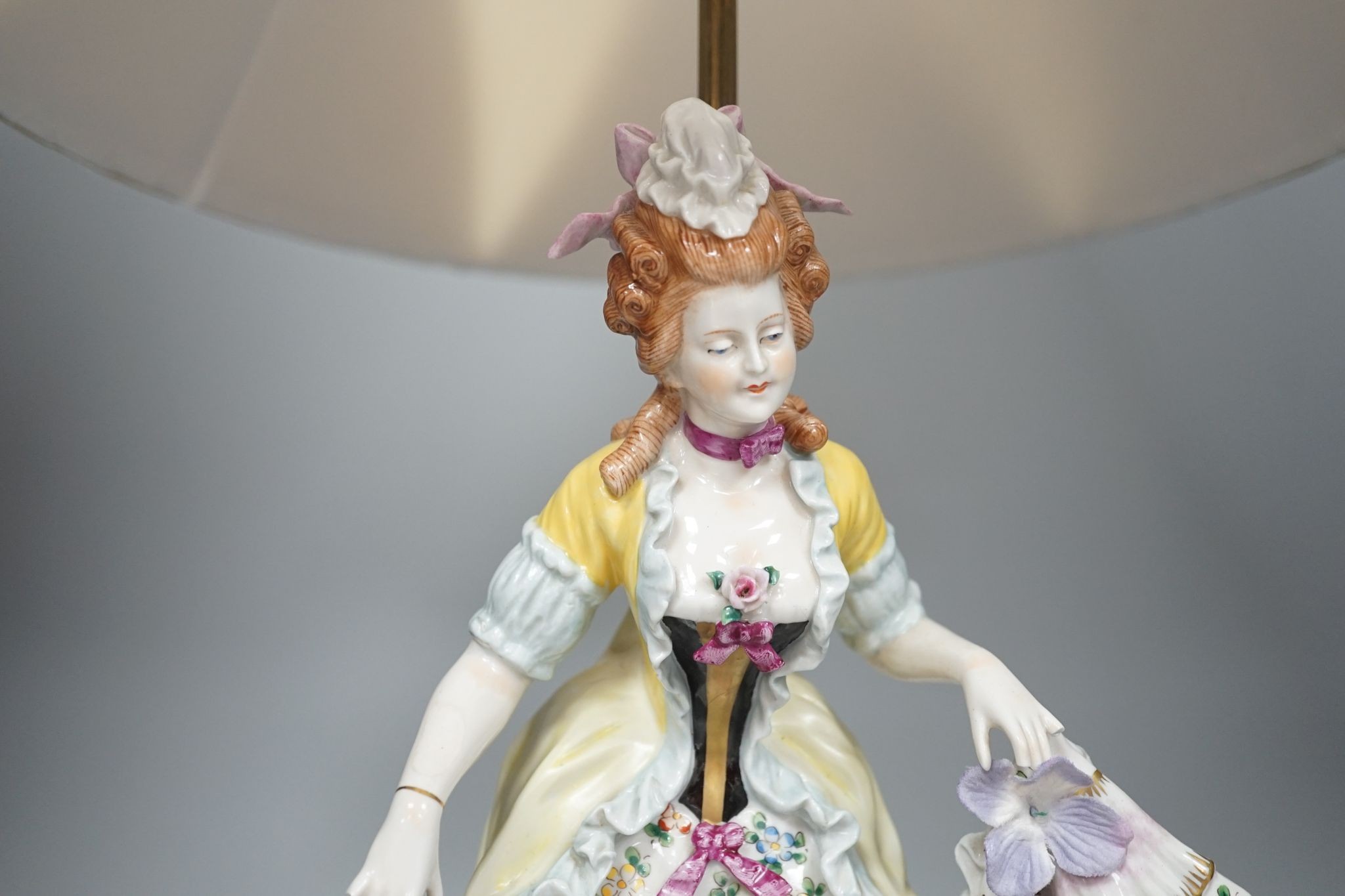 A German porcelain ‘dancing lady’ lamp, figure 29 cms high.